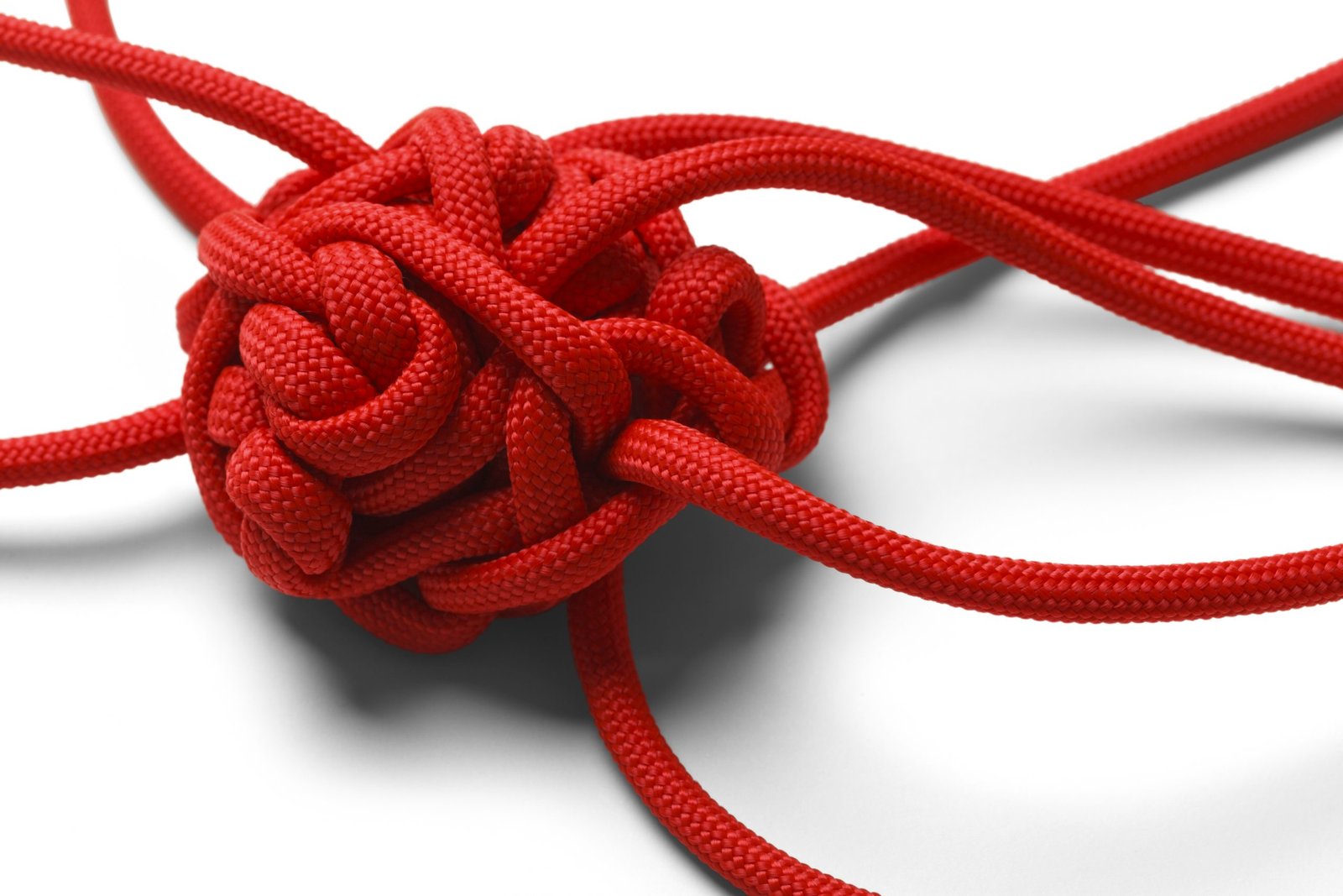 Knot Tangle Red Rope in A Tangled Mess Isolated on White Background.